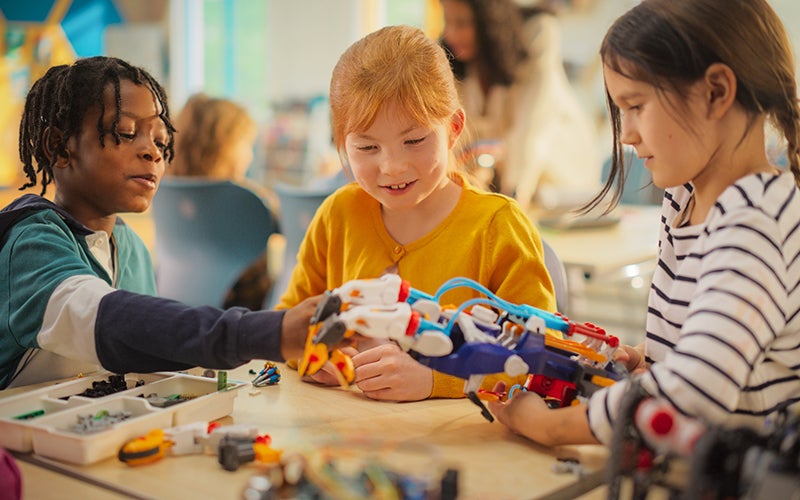 kids playing with robotic toys